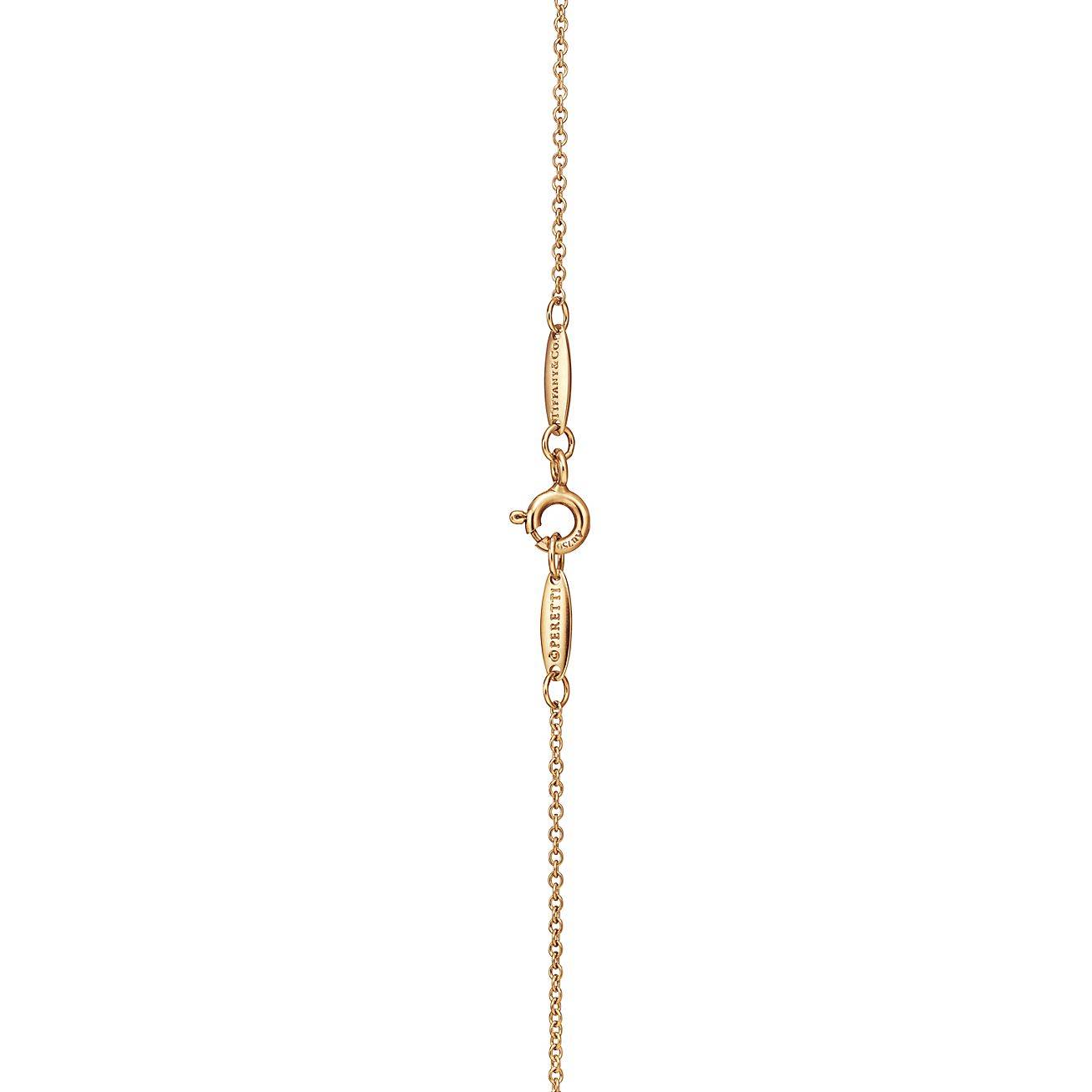 T*f*ny elsa peretti® open heart pendant in yellow gold with emeralds, 16 mm