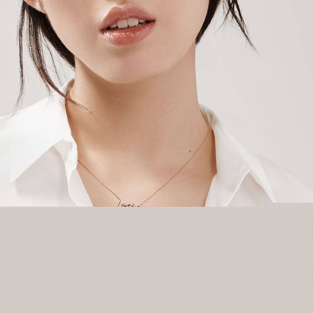 T*f*ny palomas graffiti love pendant